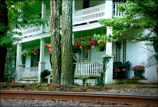 House next to railroad tracks